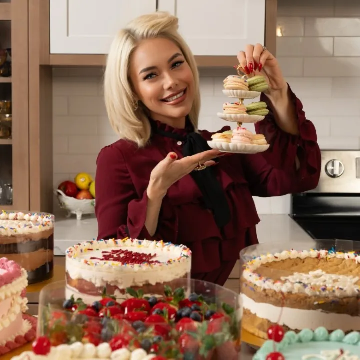 Jackie with her cakes and macarons